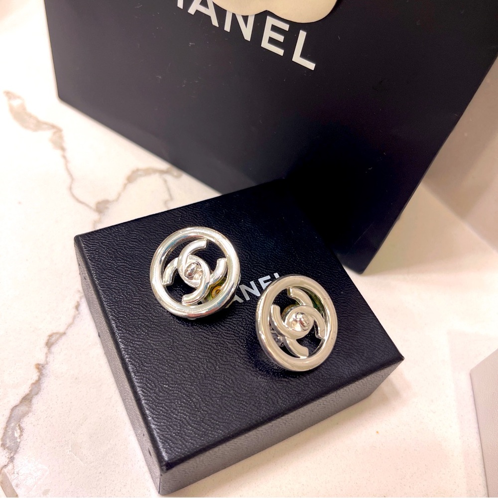 Authentic Chanel clip on turnlock earrings silver